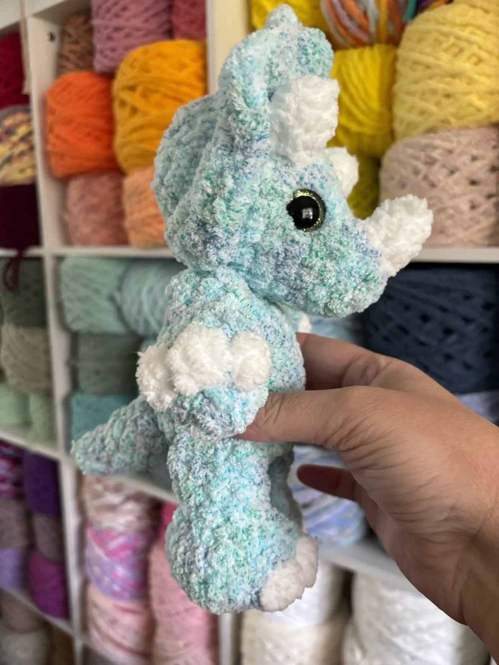 Crochet baby Triceratops plush.